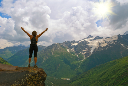 Young, beautiful girl in mountains