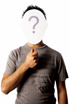 photo with a man and a questionmark mask that can be used for concepts such as identity theft, and other identity issues