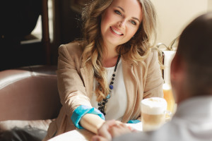 Happy couple drinking coffee in a local cafe.